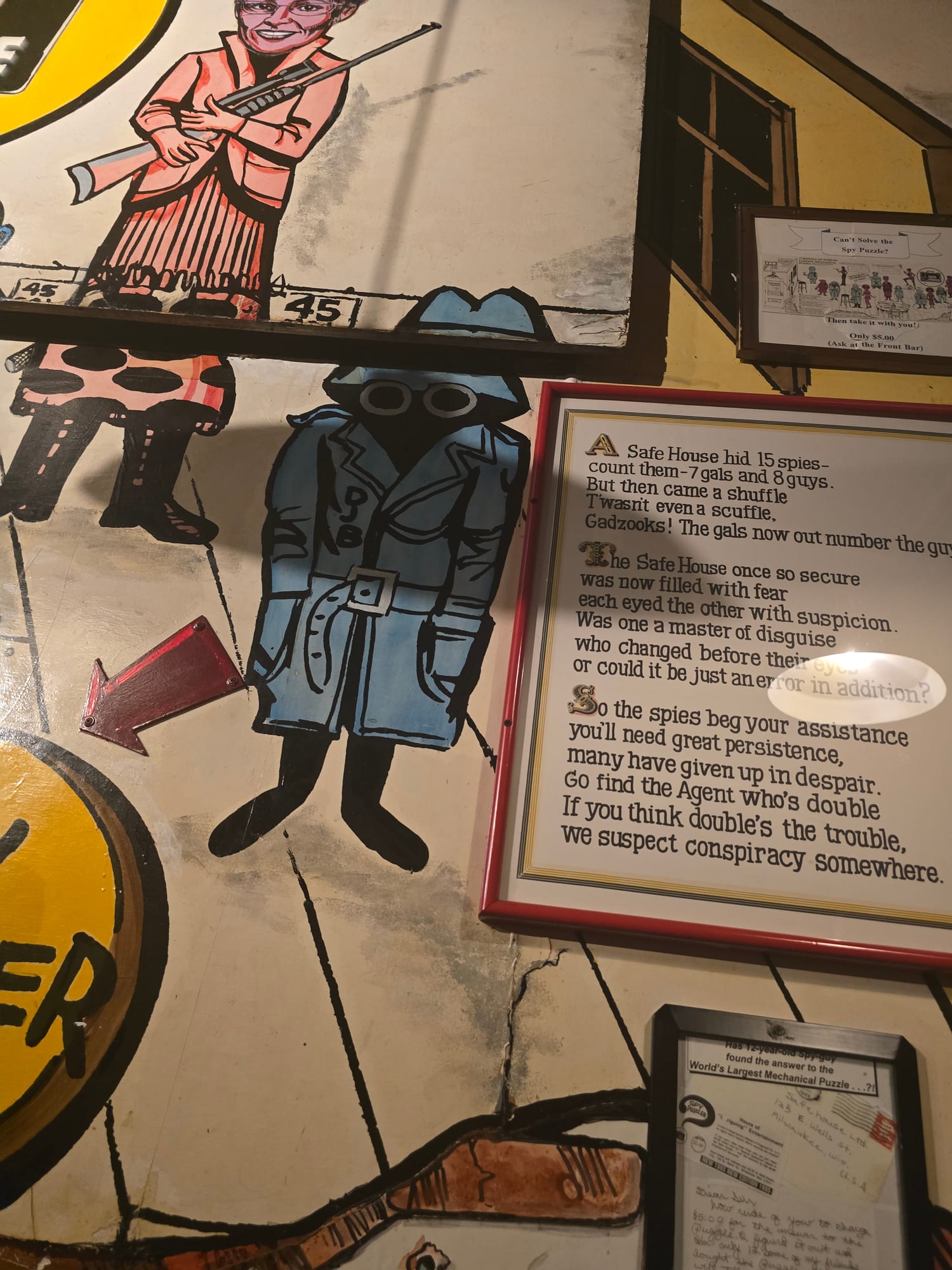 wall with 1960's style spy characters painted on it
