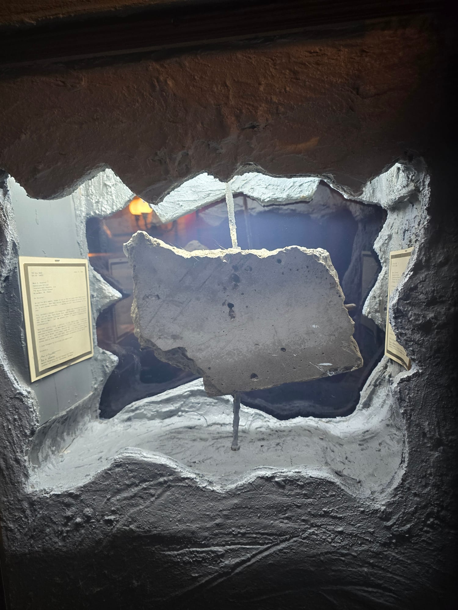 display with a chunk of cement that is said to be part of the former Berlin Wall